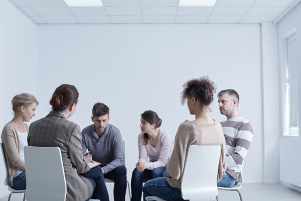 People participtaing in group psychotherapy