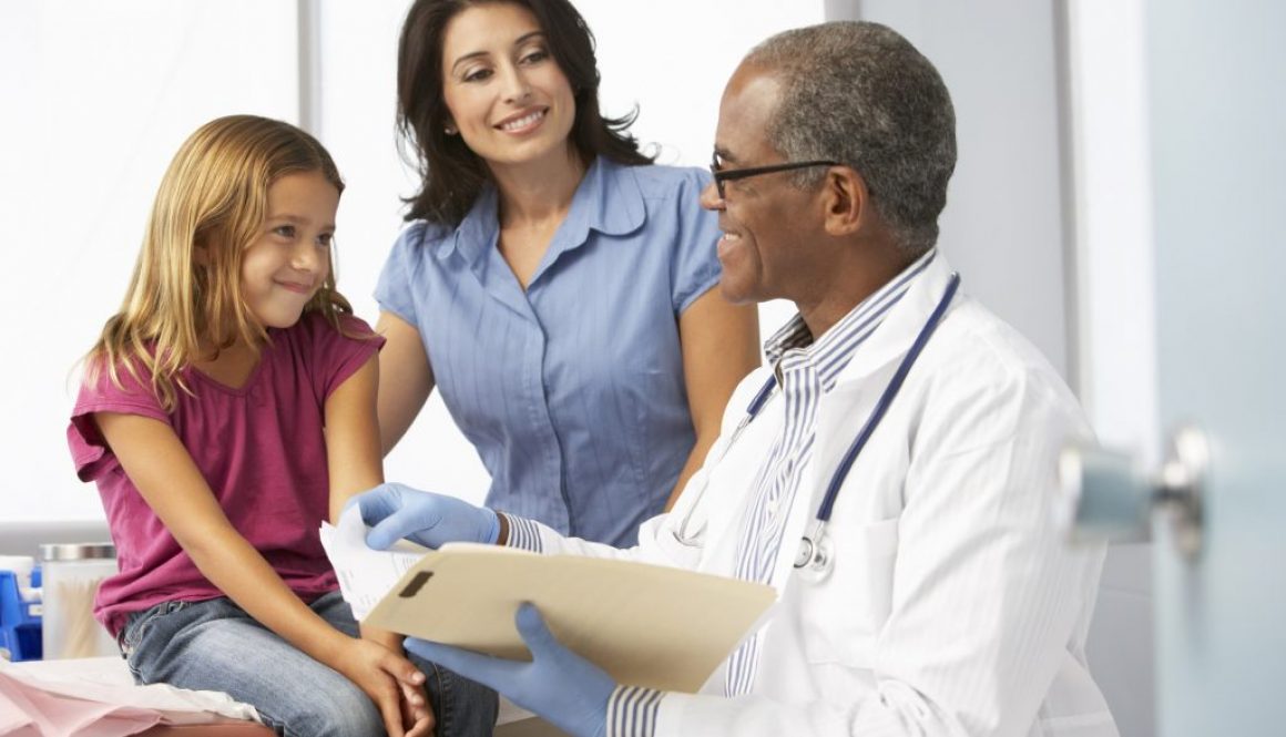 Doctor In Surgery Examining Young Girl